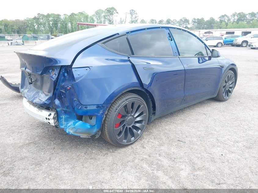 2022 Tesla Model Y VIN 7SAYGDEF3NF372818 IAAI salvage auction — Rear End, Rebuildable (Florida), sold $11,550 on 2026-04-30 (photo 4)