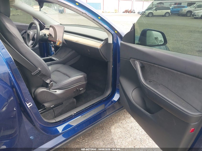 2022 Tesla Model Y VIN 7SAYGDEF3NF372818 IAAI salvage auction — Rear End, Rebuildable (Florida), sold $11,550 on 2026-04-30 (photo 5)