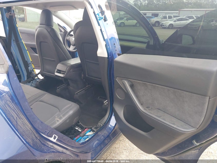 2022 Tesla Model Y VIN 7SAYGDEF3NF372818 IAAI salvage auction — Rear End, Rebuildable (Florida), sold $11,550 on 2026-04-30 (photo 8)
