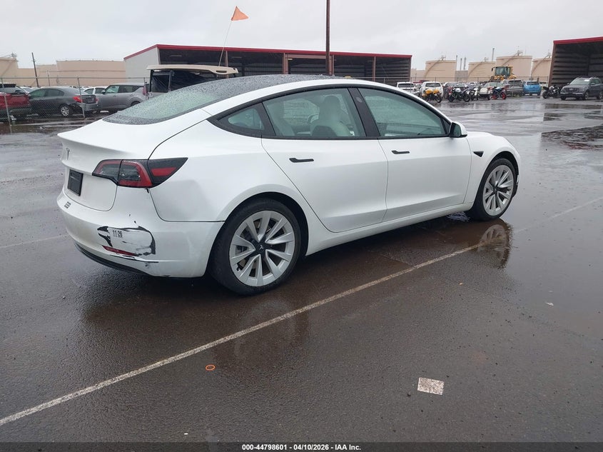 2023 Tesla Model 3 VIN 5YJ3E1EAXPF654182 IAAI salvage auction — RIGHT REAR, Salvage (Hawaii), sold $1,050 on 2026-07-23 (photo 4)
