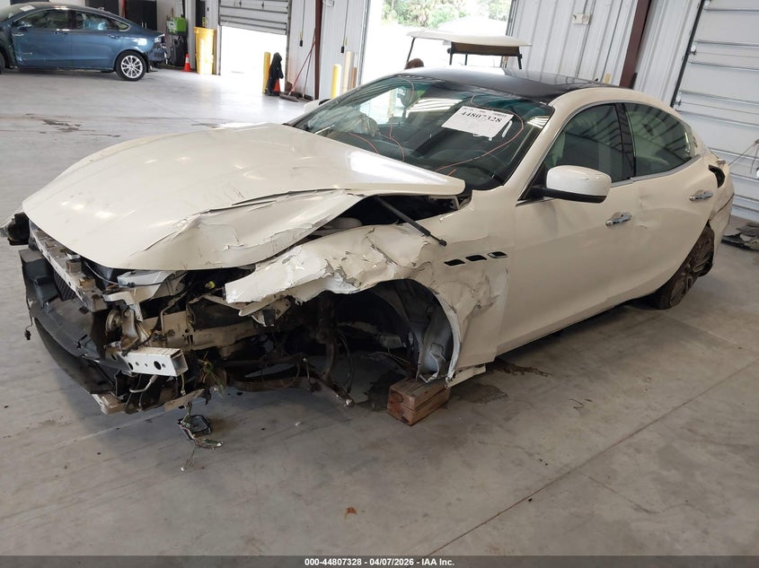 2014 Maserati Ghibli VIN ZAM57RTA2E1087679 IAAI salvage auction — FRONT & REAR, Salvage Title, sold $975 on 2026-07-30 (photo 2)