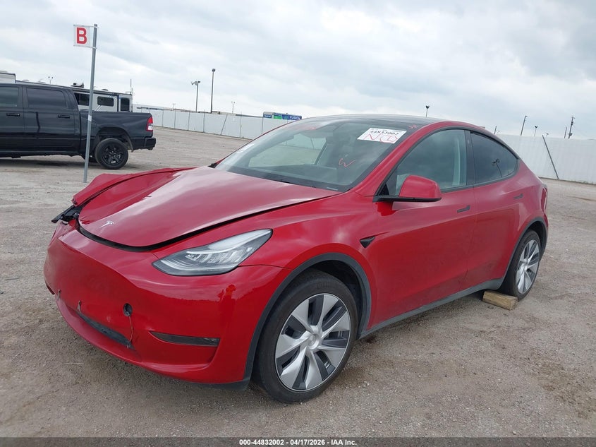 2023 Tesla Model y VIN 7SAYGDEE2PA065809 IAAI salvage auction — RIGHT FRONT, Salvage Title, sold $10,200 on 2026-07-08 (photo 2)