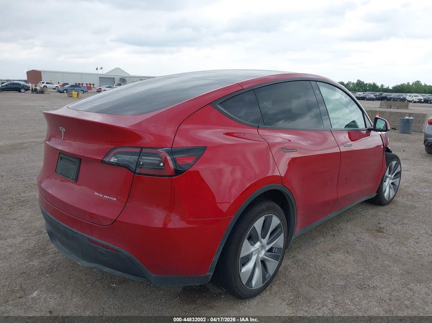2023 Tesla Model y VIN 7SAYGDEE2PA065809 IAAI salvage auction — RIGHT FRONT, Salvage Title, sold $10,200 on 2026-07-08 (photo 4)