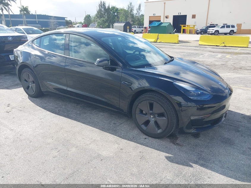 2023 Tesla Model 3 VIN 5YJ3E1EA6PF433985 IAAI salvage auction — Normal Wear, Clear (Montana), sold $19,400 on 2026-04-16 (photo 1)