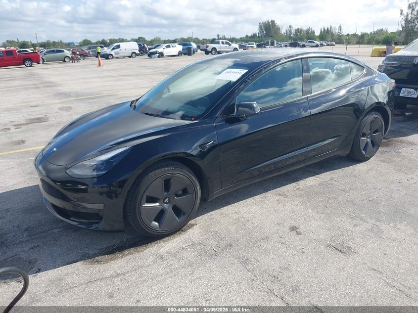 2023 Tesla Model 3 VIN 5YJ3E1EA6PF433985 IAAI salvage auction — Normal Wear, Clear (Montana), sold $19,400 on 2026-04-16 (photo 2)
