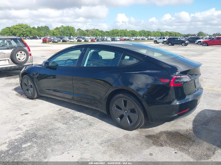 2023 Tesla Model 3 VIN 5YJ3E1EA6PF433985 IAAI salvage auction — Normal Wear, Clear (Montana), sold $19,400 on 2026-04-16 (photo 3)
