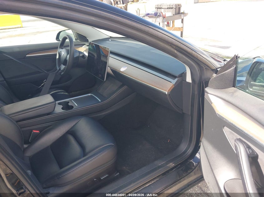 2023 Tesla Model 3 VIN 5YJ3E1EA6PF433985 IAAI salvage auction — Normal Wear, Clear (Montana), sold $19,400 on 2026-04-16 (photo 5)