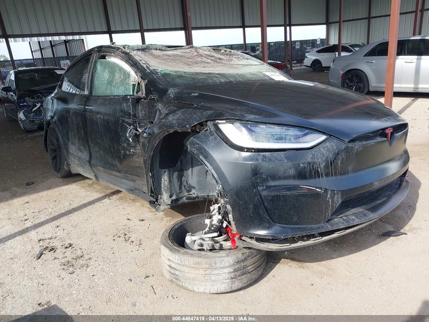 2023 Tesla Model x VIN 7SAXCBE61PF404194 IAAI salvage auction — ROLLOVER, Salvage Title, sold $11,700 on 2026-07-09 (photo 1)
