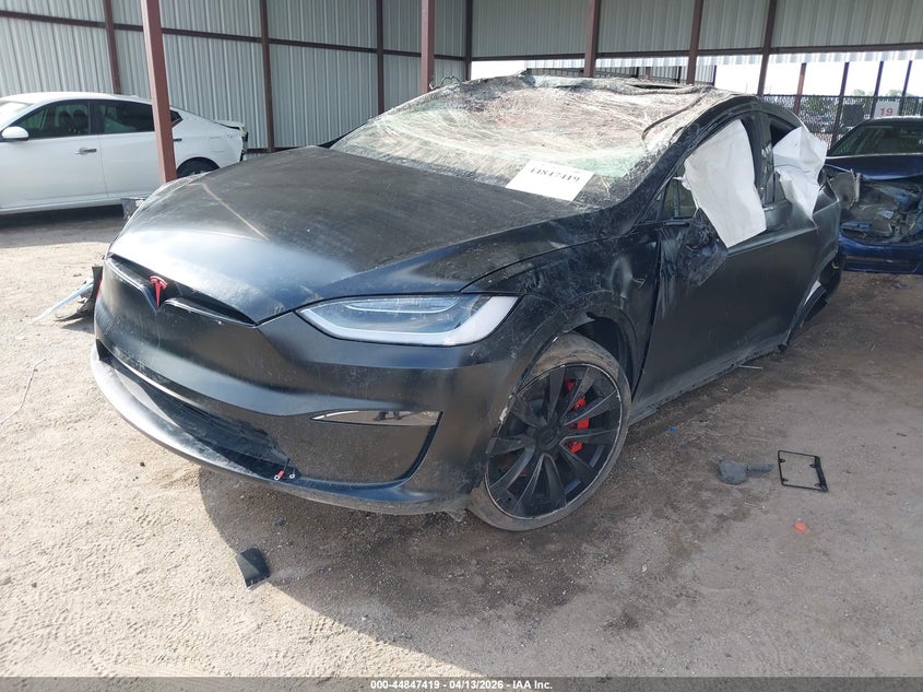 2023 Tesla Model x VIN 7SAXCBE61PF404194 IAAI salvage auction — ROLLOVER, Salvage Title, sold $11,700 on 2026-07-09 (photo 2)
