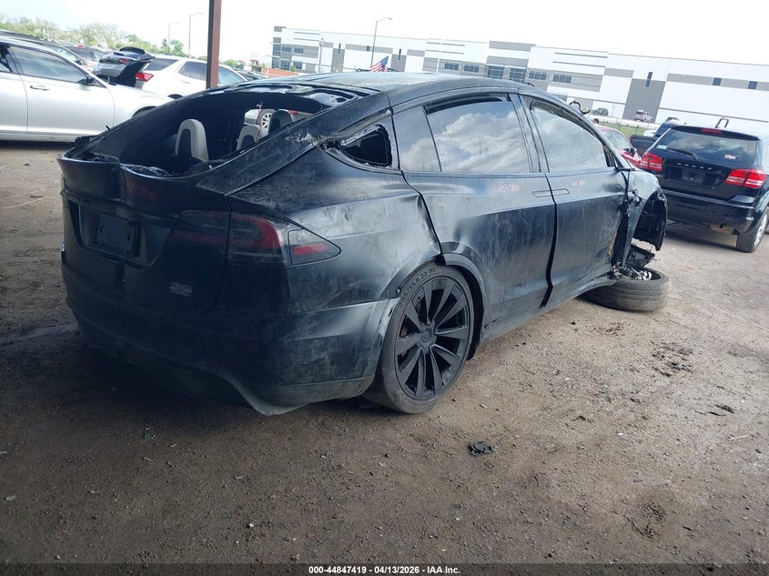 2023 Tesla Model x VIN 7SAXCBE61PF404194 IAAI salvage auction — ROLLOVER, Salvage Title, sold $11,700 on 2026-07-09 (photo 4)