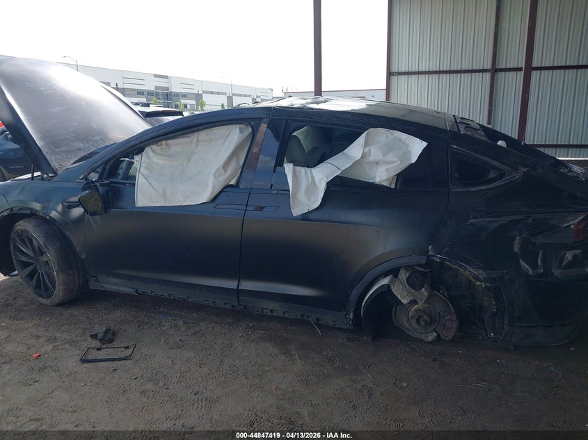 2023 Tesla Model x VIN 7SAXCBE61PF404194 IAAI salvage auction — ROLLOVER, Salvage Title, sold $11,700 on 2026-07-09 (photo 6)