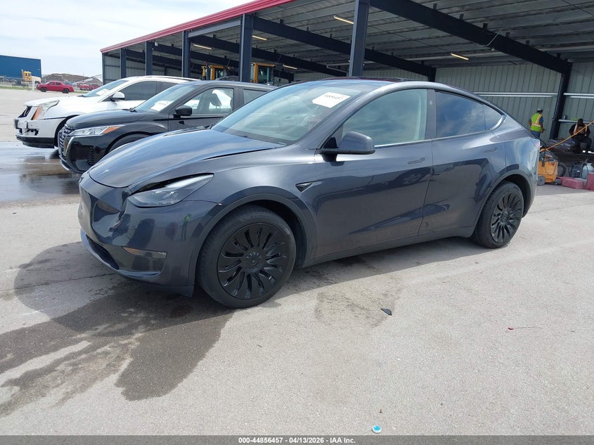 2024 Tesla Model y VIN 7SAYGDEE6RA255826 IAAI salvage auction — FRONT & REAR, Salvage (Nebraska), sold $10,500 on 2026-08-01 (photo 2)
