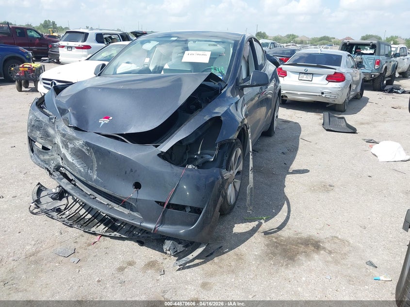 2024 Tesla Model y VIN 7SAYGAEEXRF075122 IAAI salvage auction — FRONT & REAR, Salvage (Texas), sold $50 on 2026-07-30 (photo 2)