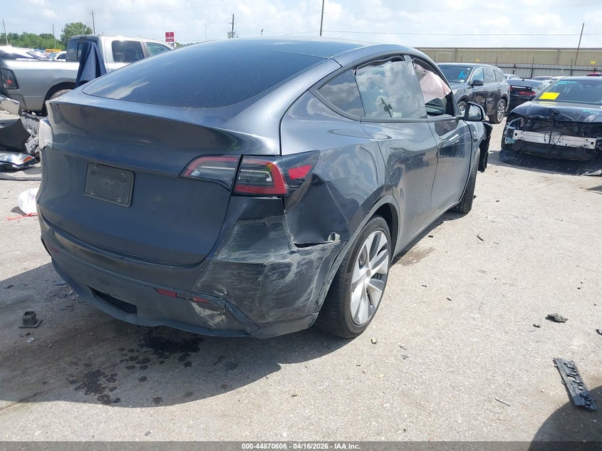 2024 Tesla Model y VIN 7SAYGAEEXRF075122 IAAI salvage auction — FRONT & REAR, Salvage (Texas), sold $50 on 2026-07-30 (photo 4)