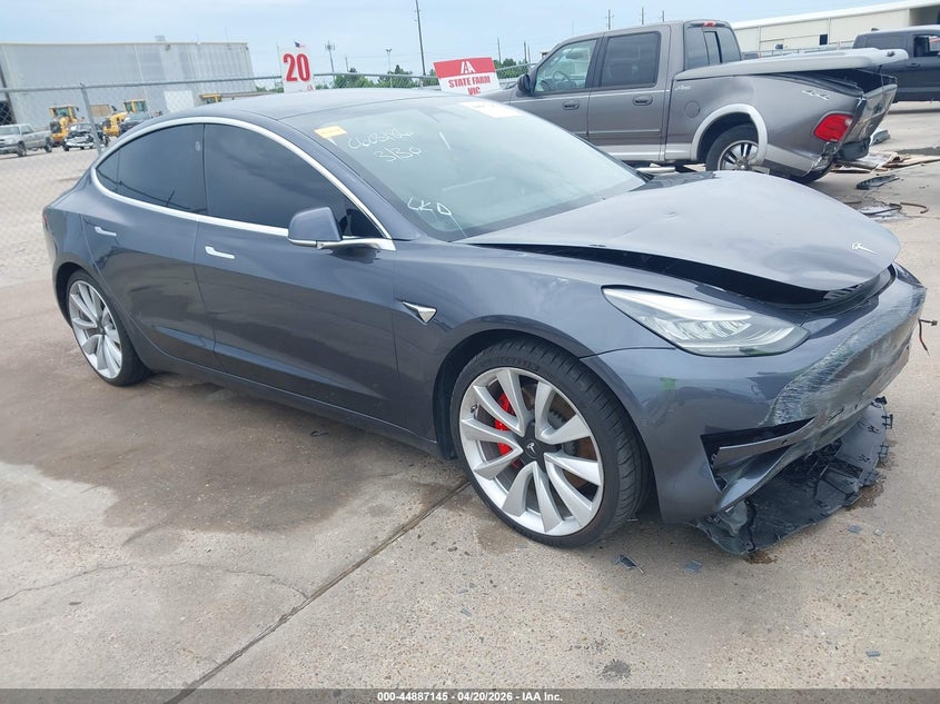 2019 Tesla Model 3 VIN 5YJ3E1EB3KF530496 IAAI salvage auction — LEFT SIDE, Wait Title, sold $5,600 on 2026-07-23 (photo 1)