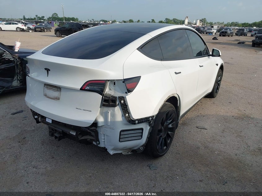 2023 Tesla Model y VIN 7SAYGAEE2PF689210 IAAI salvage auction — REAR END, Salvage Title, sold $9,600 on 2026-07-23 (photo 4)