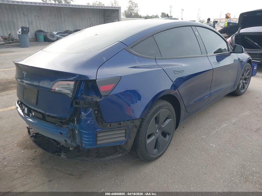2023 Tesla Model 3 VIN 5YJ3E1EA8PF617311 IAAI salvage auction — REAR END, Salvage Title, sold $7,500 on 2026-07-08 (photo 4)