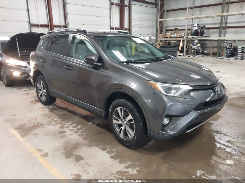 2016 Toyota Rav 4 VIN JTMRFREV0GJ077499 IAAI salvage auction — SIDE, Wait Title, sold $3,950 on 2026-07-30 (photo 1)