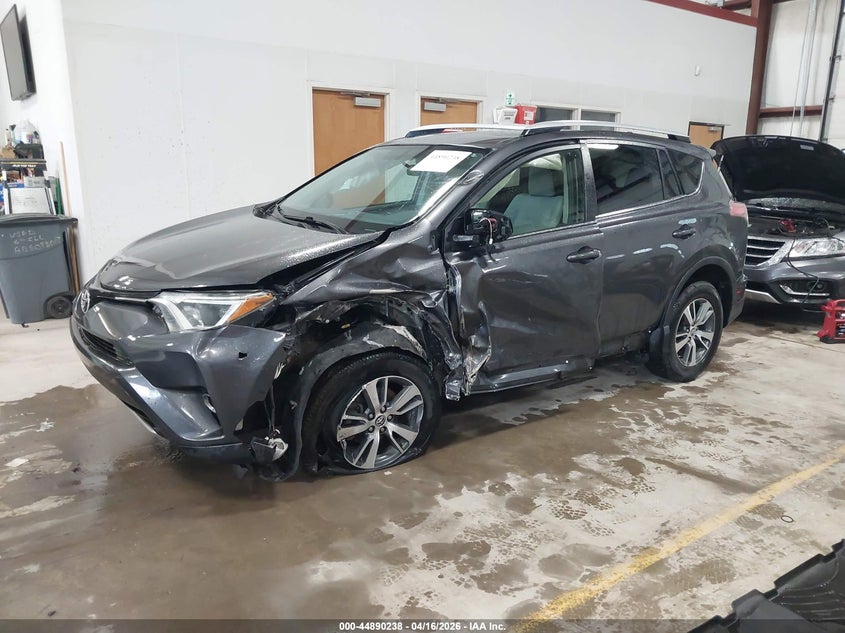 2016 Toyota Rav 4 VIN JTMRFREV0GJ077499 IAAI salvage auction — SIDE, Wait Title, sold $3,950 on 2026-07-30 (photo 2)