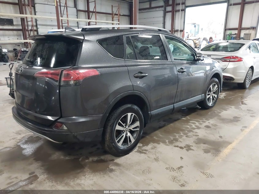 2016 Toyota Rav 4 VIN JTMRFREV0GJ077499 IAAI salvage auction — SIDE, Wait Title, sold $3,950 on 2026-07-30 (photo 4)