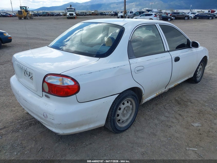 1999 Kia Sephia VIN KNAFB121XX5773598 IAAI salvage auction — ALL OVER, Clear (Montana), sold $150 on 2026-07-15 (photo 4)