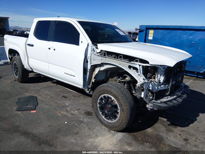 2024 Toyota Tacoma VIN 3TMLB5JN9RM047939 IAAI salvage auction — FRONT & REAR, Salvage Title, sold $18,900 on 2026-07-09 (photo 1)
