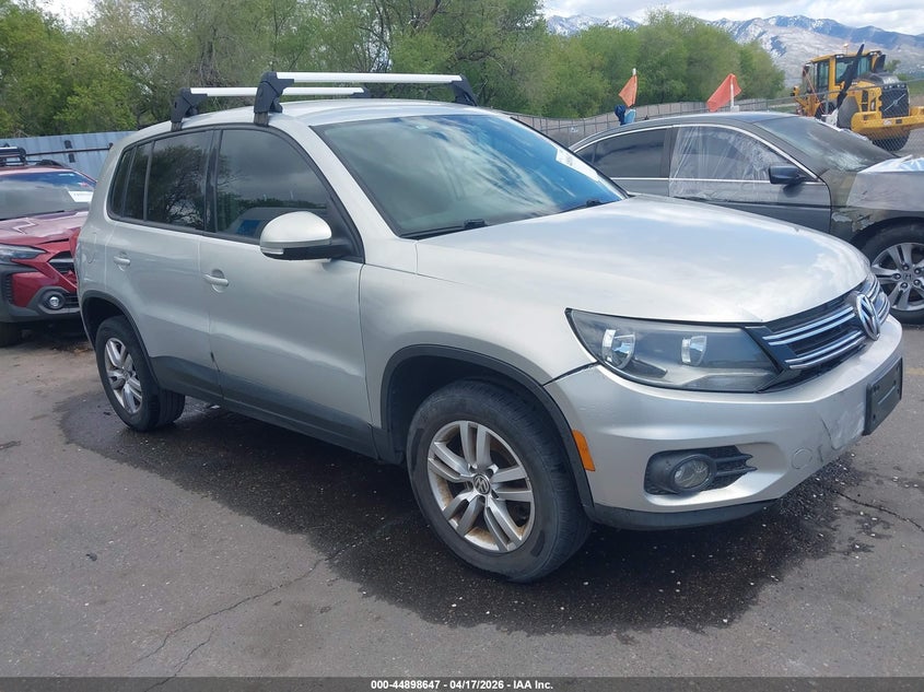 2014 Volkswagen Tiguan VIN WVGAV3AXXEW506924 IAAI salvage auction — LEFT SIDE, Salvage Title, sold $450 on 2026-07-16 (photo 1)