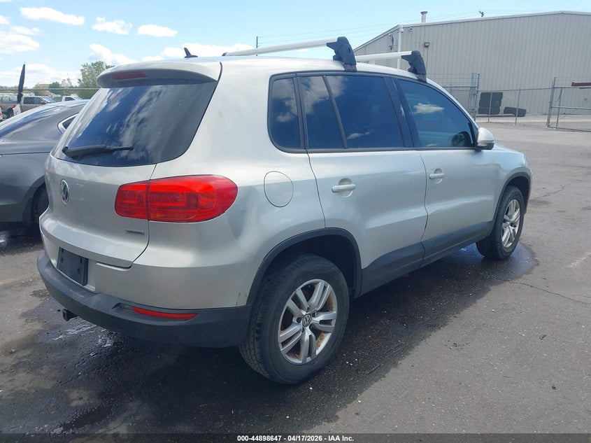 2014 Volkswagen Tiguan VIN WVGAV3AXXEW506924 IAAI salvage auction — LEFT SIDE, Salvage Title, sold $450 on 2026-07-16 (photo 4)
