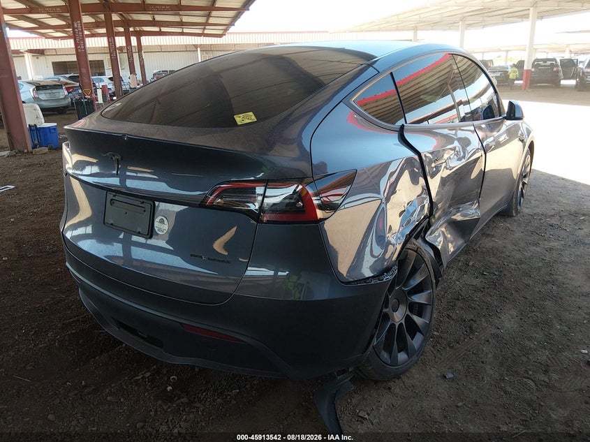 2023 Tesla Model y VIN 7SAYGDEE1PF644762 IAAI salvage auction — RIGHT SIDE, Salvage (Arizona), sold $10,950 on 2026-09-06 (photo 4)