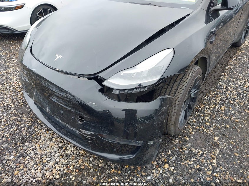 2023 Tesla Model y VIN 7SAYGDEE0PA183390 IAAI salvage auction — FRONT & REAR, Salvage Title, sold $9,500 on 2026-09-06 (photo 6)