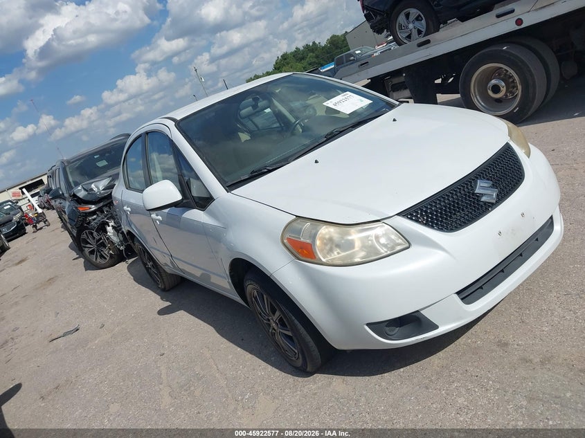 2012 Suzuki Sx4 VIN JS2YC5A38C6300554 IAAI salvage auction — REPOSSESSION, Original (Texas), sold $1,000 on 2026-09-19 (photo 1)