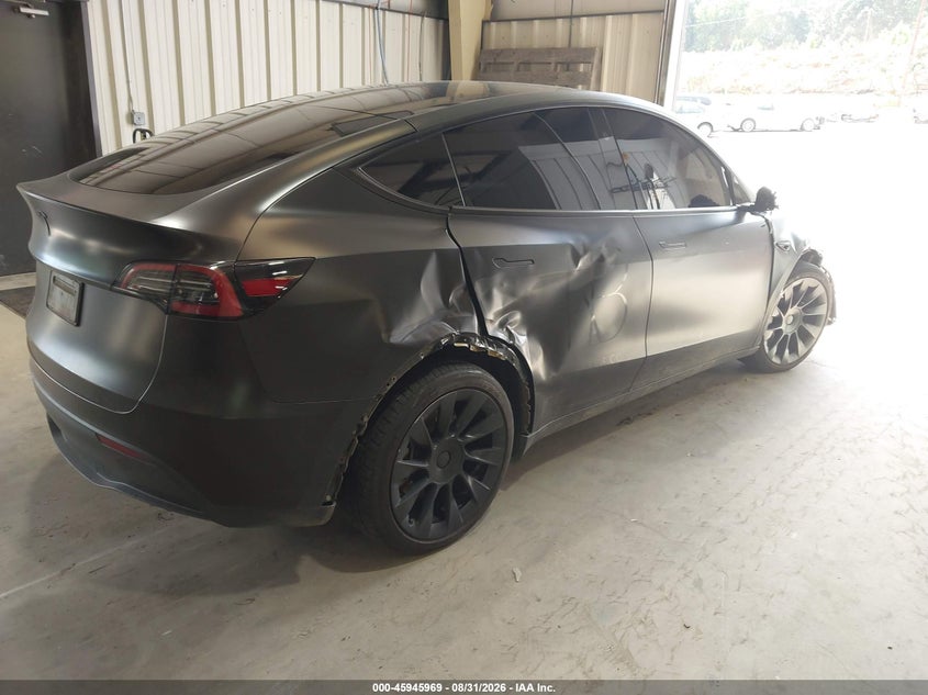 2023 Tesla Model y VIN 7SAYGDEE1PA163391 IAAI salvage auction — RIGHT FRONT, Salvage Title, sold $4,950 on 2026-10-15 (photo 4)