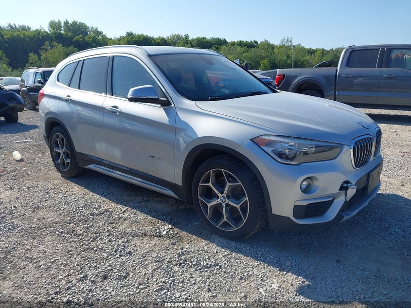 2016 BMW X1 VIN WBXHT3C34GP889052 IAAI salvage auction — WATER/FLOOD, Salvage (Ohio), sold $2,000 on 2026-10-22 (photo 1)