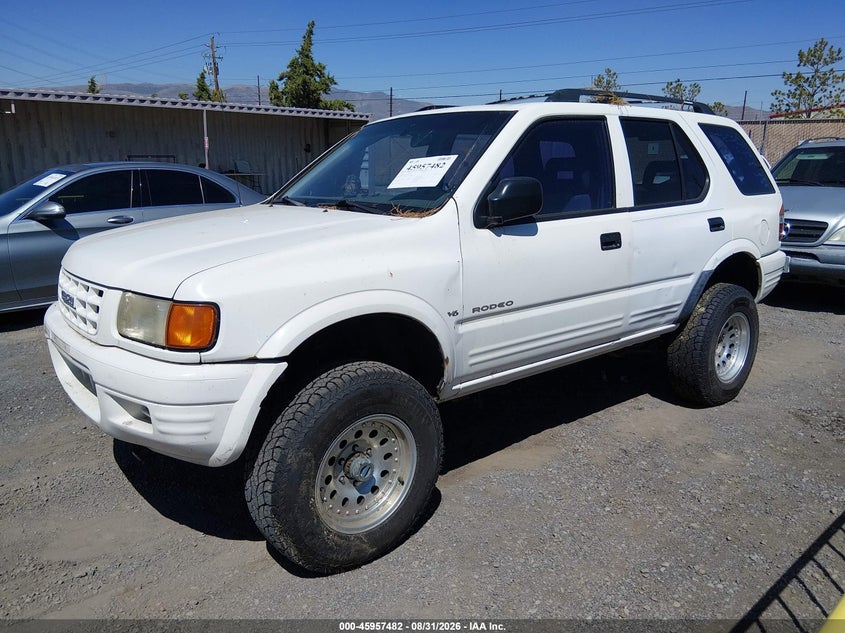 1999 Isuzu Rodeo VIN 4S2CM58WXX4361122 IAAI salvage auction — NORMAL WEAR, Regular (Nevada), sold $25 on 2026-09-18 (photo 2)