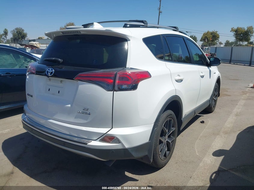 2018 Toyota Rav4 hybrid VIN JTMJJREV9JD247991 IAAI salvage auction — NORMAL WEAR, Salvage Title - Dealer (California), sold $9,075 on 2026-09-22 (photo 4)