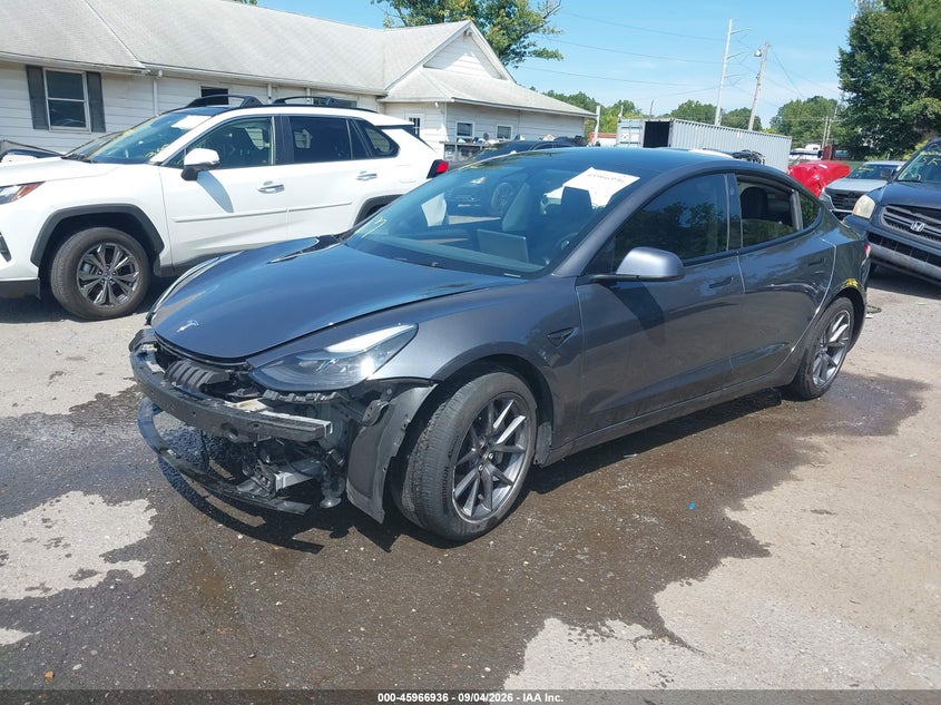 2023 Tesla Model 3 VIN 5YJ3E1EB5PF674137 IAAI salvage auction — FRONT & REAR, Wait Title, sold $10,900 on 2026-10-23 (photo 2)