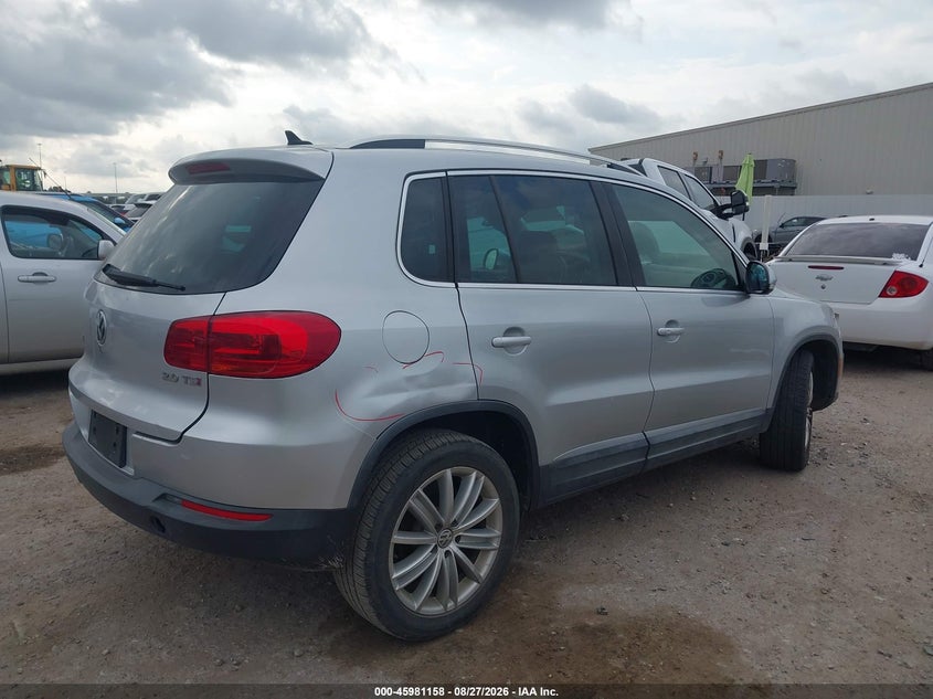 2014 Volkswagen Tiguan VIN WVGAV3AX4EW622202 IAAI salvage auction — WATER/FLOOD, Salvage Title, sold $600 on 2026-10-07 (photo 4)