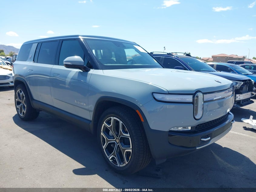 2024 Rivian R1s VIN 7PDSGBBAXRN040150 IAAI salvage auction — SIDE, Salvage Title, sold $23,200 on 2026-10-20 (photo 1)