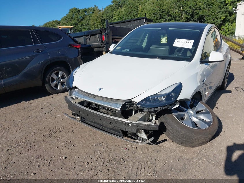 2023 Tesla Model y VIN 7SAYGDEE4PF706185 IAAI salvage auction — LEFT FRONT, Salvage (Massachusetts), sold $12,200 on 2026-10-01 (photo 6)