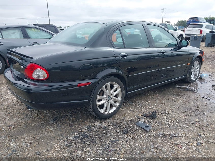 2002 Jaguar X type VIN SAJEA53DX2XC79549 IAAI salvage auction — NORMAL WEAR, Clear-Endorsement (Wisconsin), sold $275 on 2026-10-07 (photo 4)
