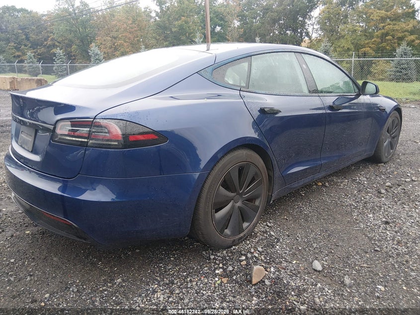 2023 Tesla Model s VIN 5YJSA1E51PF502947 IAAI salvage auction — WATER/FLOOD, Salvage (Idaho), sold $27,600 on 2026-10-22 (photo 4)