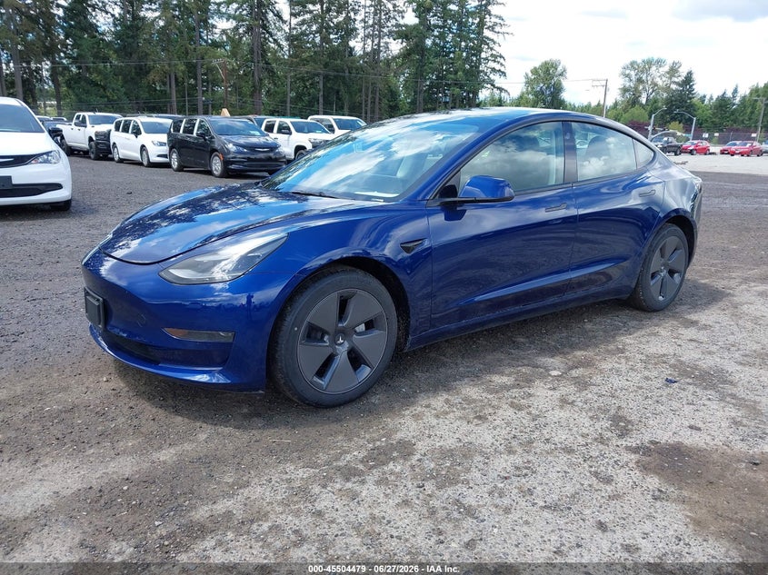 2023 Tesla Model 3 VIN 5YJ3E1EA4PF711492 IAAI salvage auction — NORMAL WEAR, Sf97 (Washington), sold $10,700 on 2026-07-29 (photo 2)