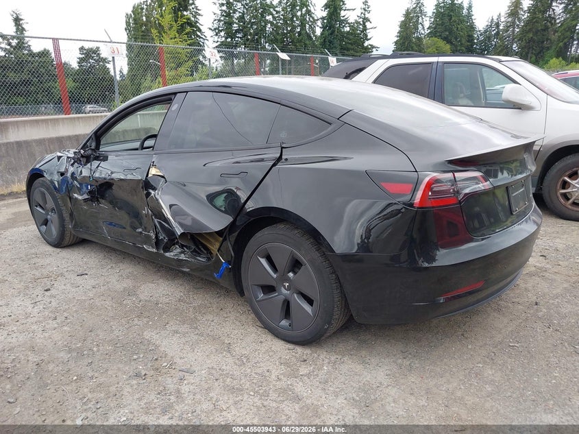 2023 Tesla Model 3 VIN 5YJ3E1EA5PF661685 IAAI salvage auction — SIDE, Salvage Title, sold $9,300 on 2026-07-16 (photo 3)