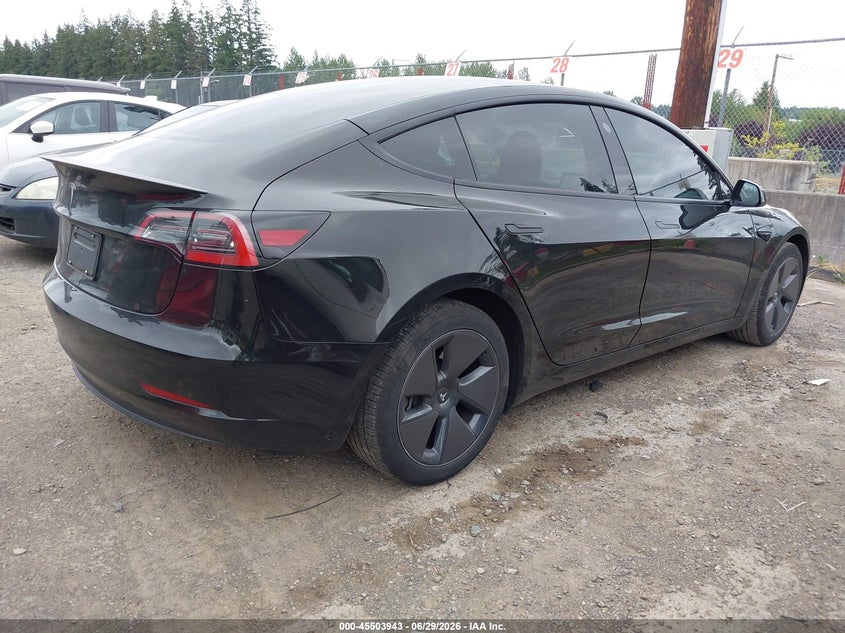 2023 Tesla Model 3 VIN 5YJ3E1EA5PF661685 IAAI salvage auction — SIDE, Salvage Title, sold $9,300 on 2026-07-16 (photo 4)