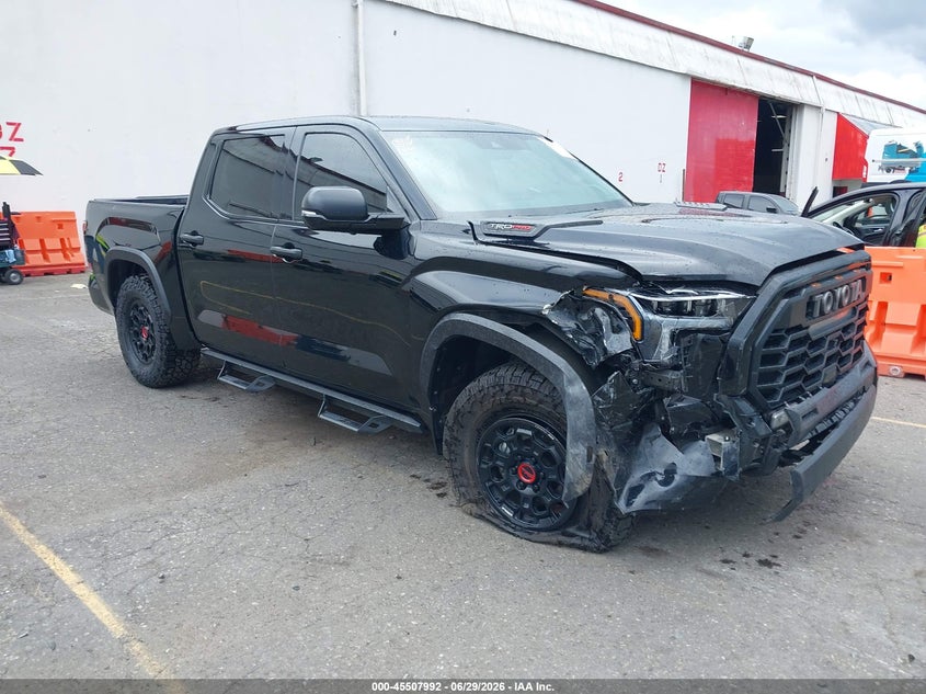 2023 Toyota Tundra VIN 5TFPC5DBXPX032521 IAAI salvage auction — FRONT & REAR, Salvage Title, sold $29,975 on 2026-10-01 (photo 1)