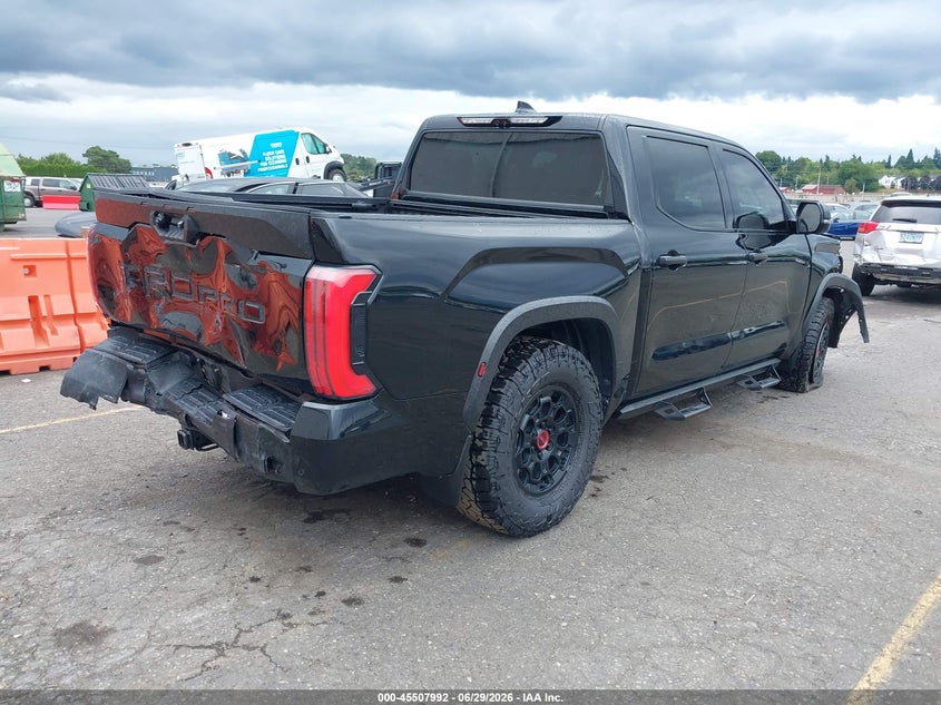 2023 Toyota Tundra VIN 5TFPC5DBXPX032521 IAAI salvage auction — FRONT & REAR, Salvage Title, sold $29,975 on 2026-10-01 (photo 4)