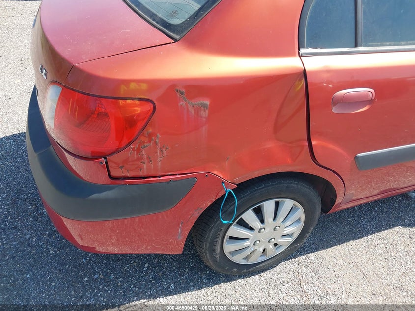 2009 Kia Rio VIN KNADE223496519260 IAAI salvage auction — NORMAL WEAR, Clear (Florida), sold $250 on 2026-07-28 (photo 6)
