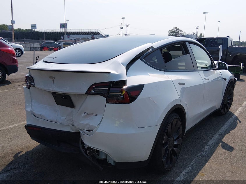 2023 Tesla Model y VIN 7SAYGDEF1PF868932 IAAI salvage auction — FRONT & REAR, Salvage Title, sold $10,950 on 2026-08-27 (photo 4)