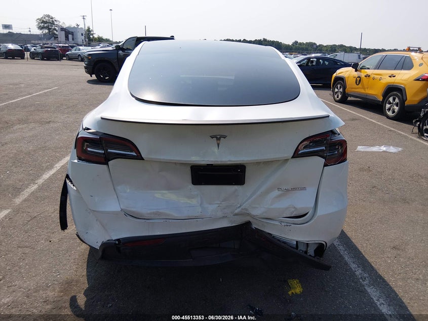2023 Tesla Model y VIN 7SAYGDEF1PF868932 IAAI salvage auction — FRONT & REAR, Salvage Title, sold $10,950 on 2026-08-27 (photo 6)