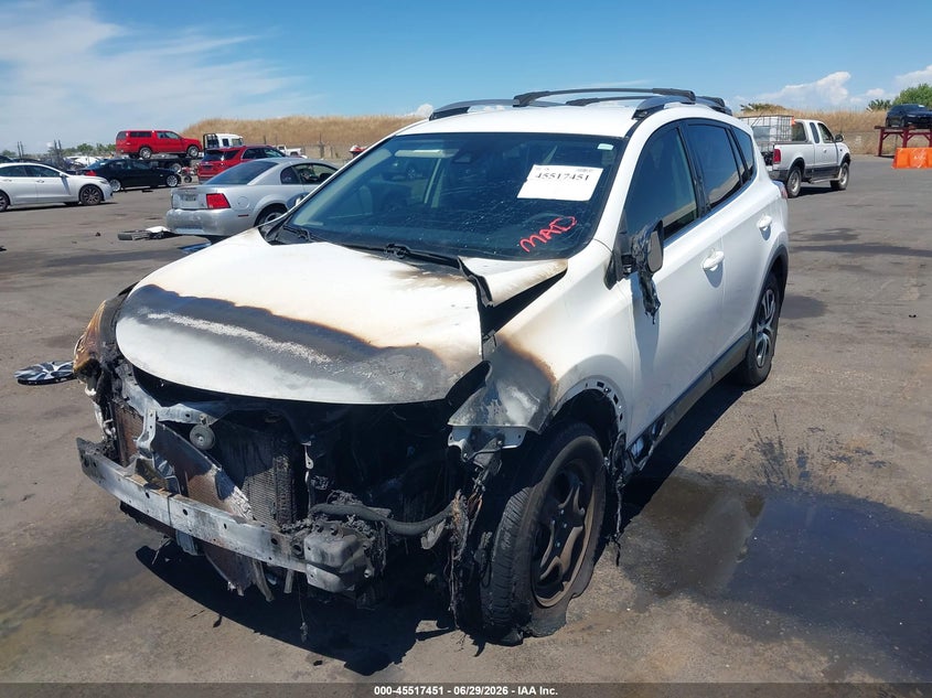 2018 Toyota Rav 4 VIN JTMBFREV3JD243425 IAAI salvage auction — EXTERIOR BURN, Salvage Title, sold $1,050 on 2026-07-22 (photo 2)